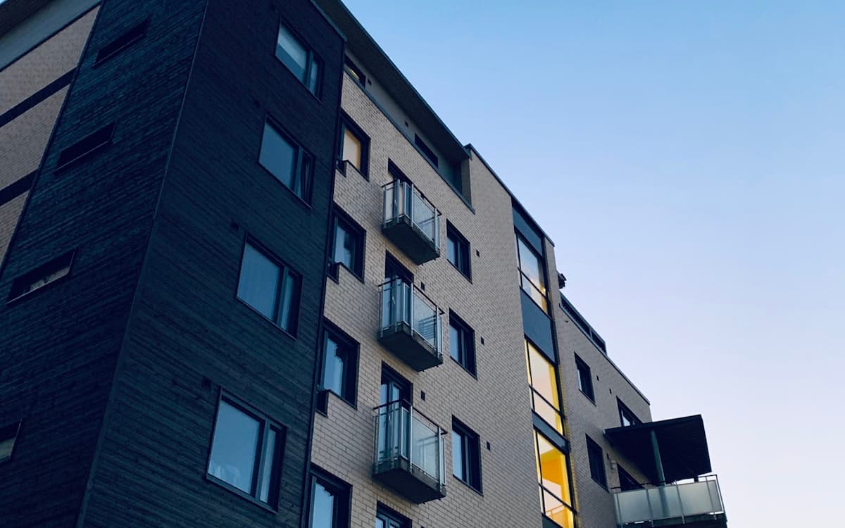 A residential apartment building at dusk